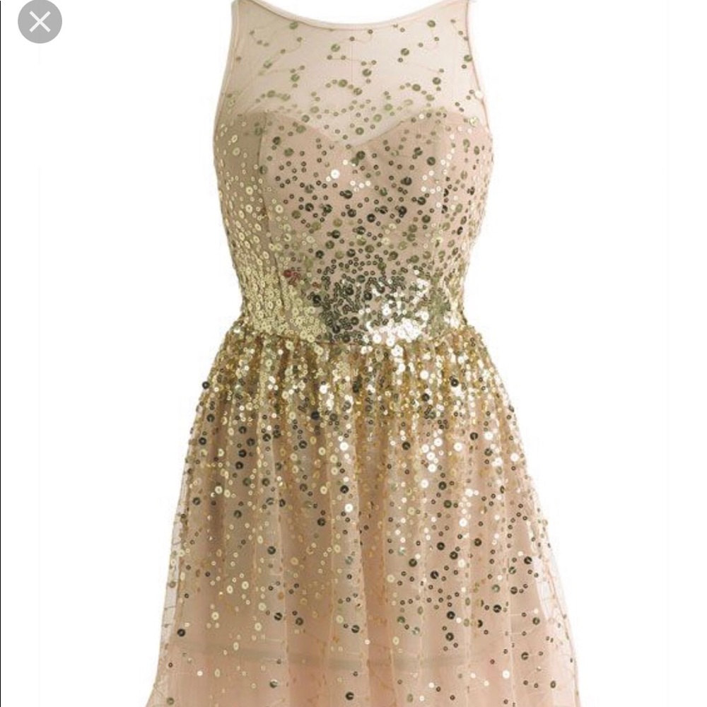 A cute sparkly gold dress for teens or adults.